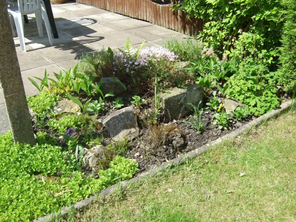 small patio featuring a cleverly designed rock garden